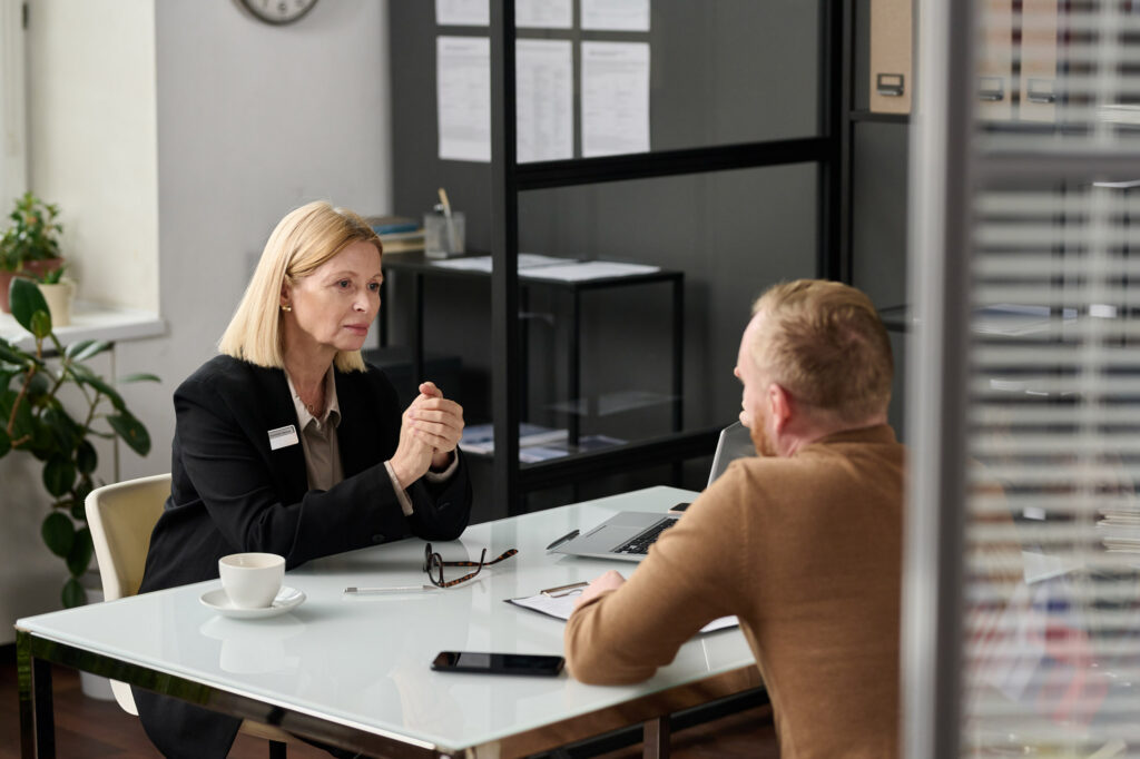 A woman and a man in an office setting